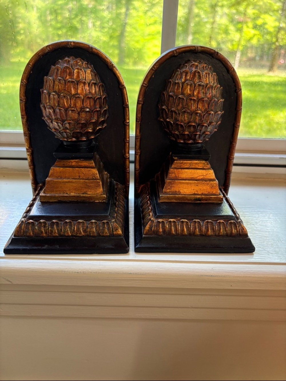 Set Of Bookends Featuring Pineapple Finial Design Atop A Tiered Base.